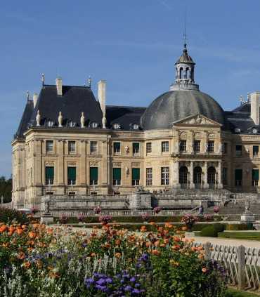 Visitors exploring Vaux-le-Vicomte Château and gardens during a best private guided tour from Paris