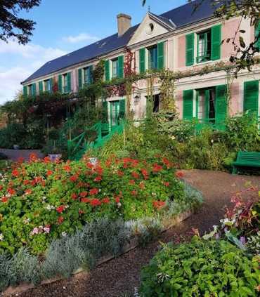 Private Giverny tour exploring the inside of Monet’s home, including his living spaces, furniture, and art displays