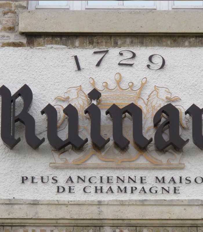 Exploring the historic Ruinart cellars in Reims on a private Champagne tour from Paris