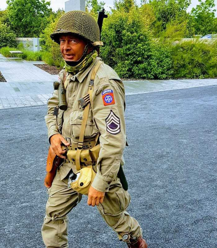 Private D-Day Normandy tour from Paris featuring a reenactor at Pointe du Hoc cliffs