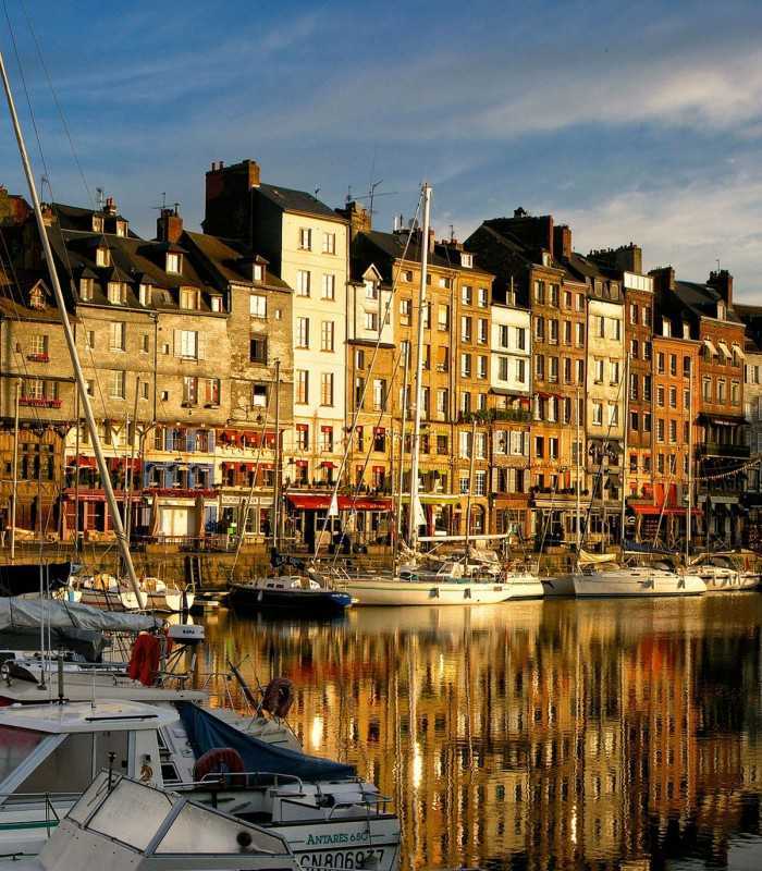 Honfleur old harbor with colorful houses during a private day tour from Paris