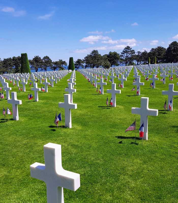 Rows of white crosses at Normandy American Cemetery overlooking Omaha Beach on a 3-day D-Day Normandy tour