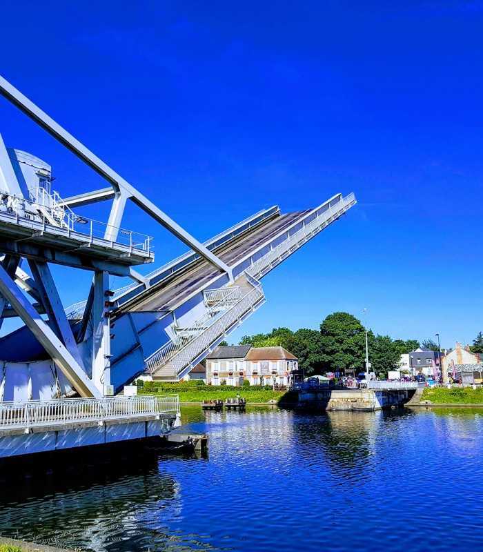 Visitors at Pegasus Bridge in Normandy, key site of the D-Day landings, on a private WWII tour.