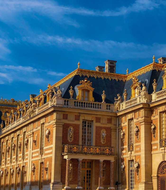 Gold-decorated roof of Versailles Castle during a private guided visit from Paris