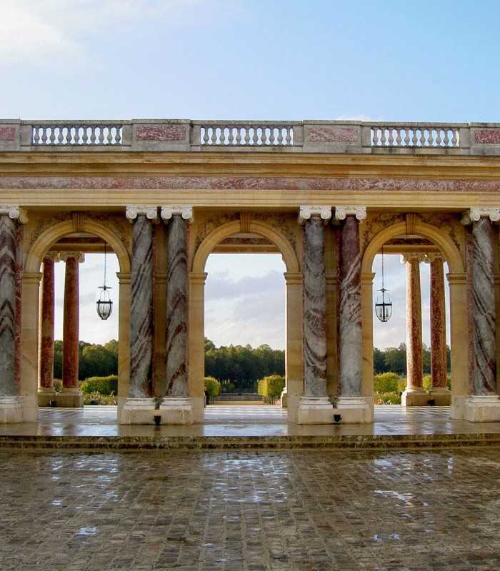 Marble exterior columns of the Grand Trianon at Versailles on a private tour.