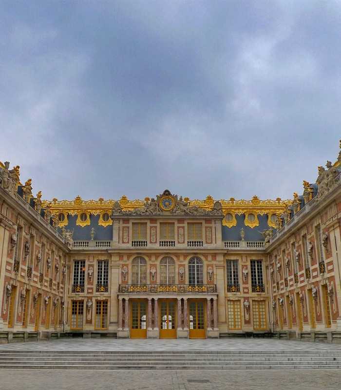 Front view of Versailles Castle showcasing black and white marble details during a private visit with your own tour guide