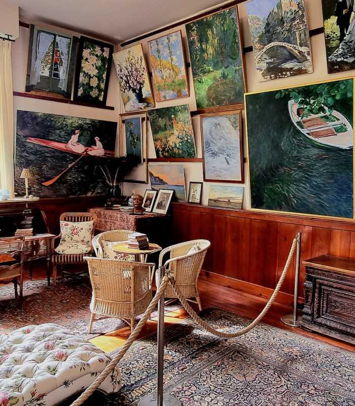 Historic Winter Workshop of Claude Monet in Giverny, France, with artwork adorning the walls, admired on a private Giverny tour