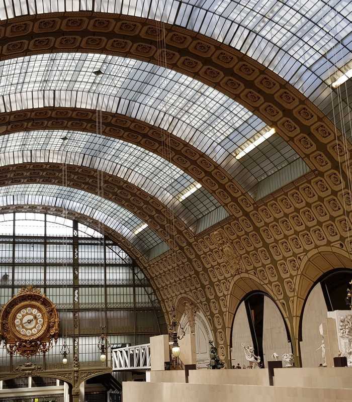 Historic Musée d’Orsay building, originally a train station, admired on a private Paris cultural tour.